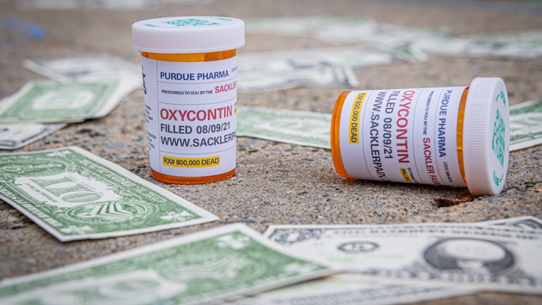 Mockups of "Oxy Dollars" and prescription bottles of OxyContin were left dropped outside the United States Bankruptcy Court in White Plains by a coalition of activists seeking redress from the United States justice system for allowing the billionaire Sackler Family to walk away unscathed after igniting the opioid crisis.