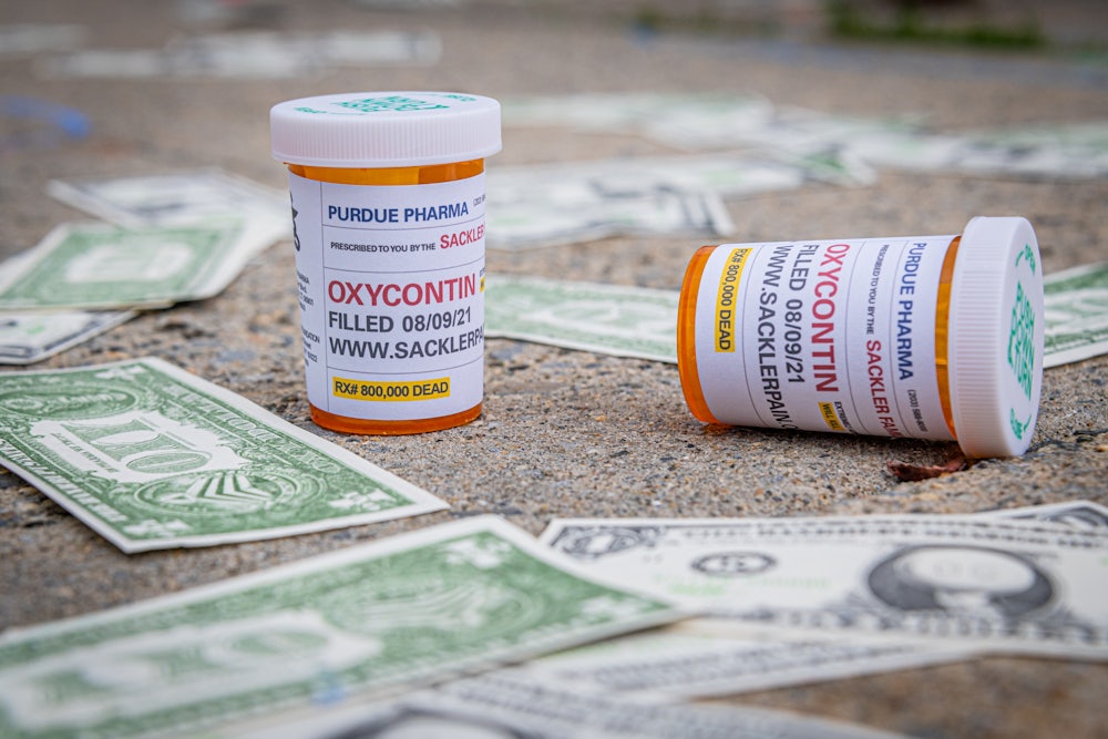 Mockups of "Oxy Dollars" and prescription bottles of OxyContin were left dropped outside the United States Bankruptcy Court in White Plains by a coalition of activists seeking redress from the United States justice system for allowing the billionaire Sackler Family to walk away unscathed after igniting the opioid crisis.
