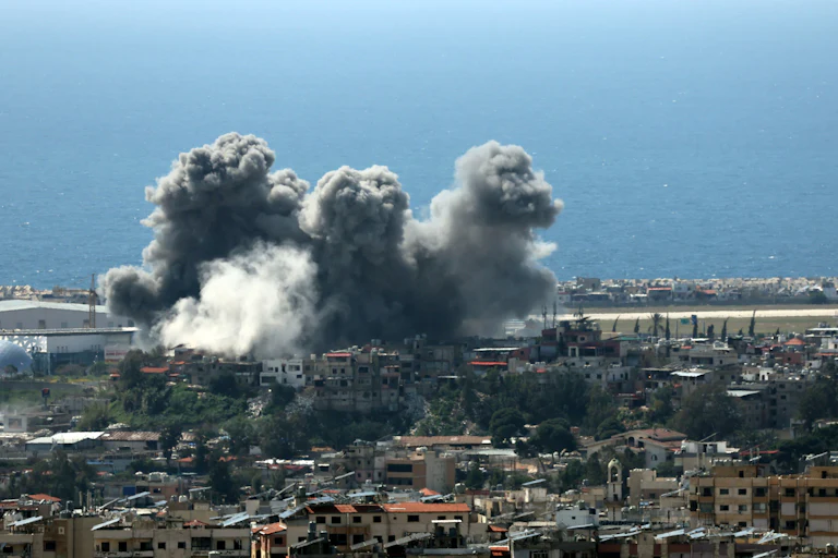 Smoke rise over Beirut after an Israeli strike.