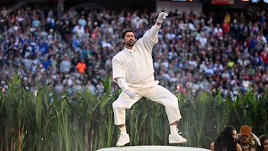 Bad Bunny dances on a car at the Super Bowl Halftime Show.