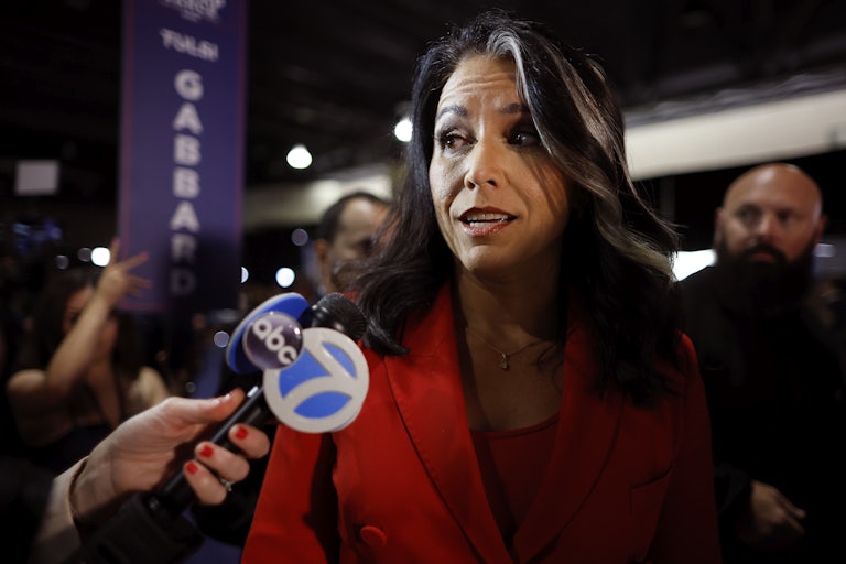 Tulsi Gabbard speaks to reporters at the presidential debate