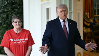Sharon Simmons wearing a "DoorDash Grandma" t-shirt stands next to President Trump as he speaks outside the Oval Office of the White House.