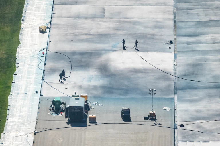 Workers paint the Reflecting Pool