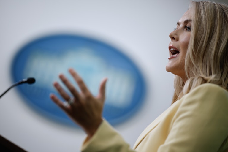 White House Press Secretary Karoline Leavitt gestures while speaking at a podium