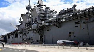 The USS Tripoli docked at a port