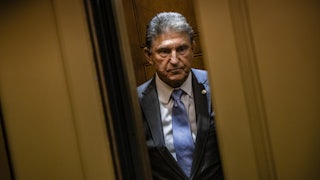 Senator Joe Manchin stands in an elevator as the door close