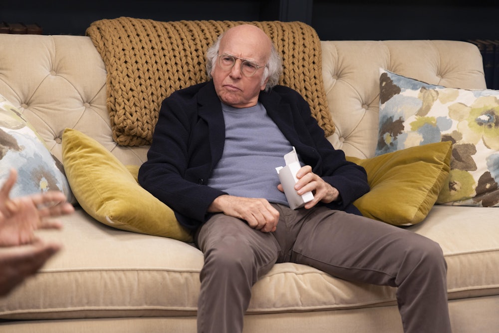 Larry David slumped on a couch in HBO’s “Curb Your Enthusiasm”