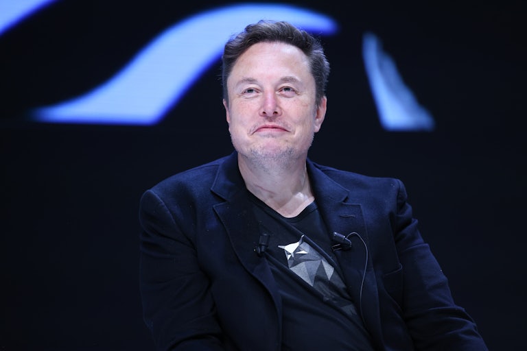 Elon Musk smiles weirdly