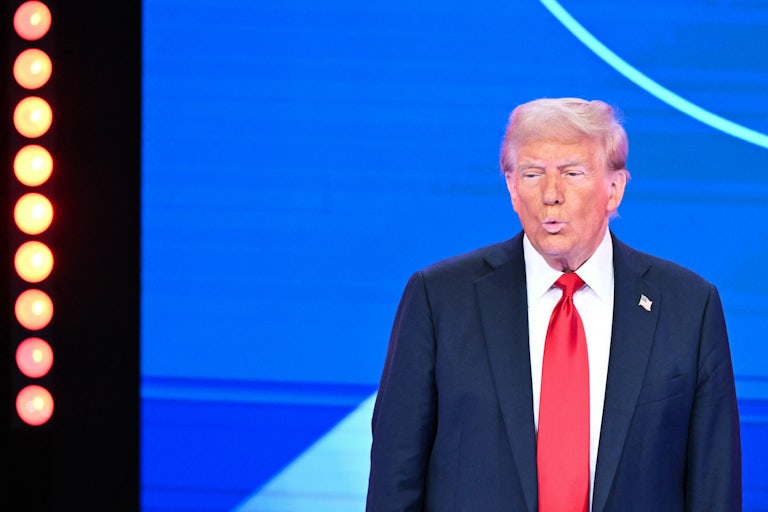 Donald Trump purses his lips while on stage during a town hall hosted by Univision