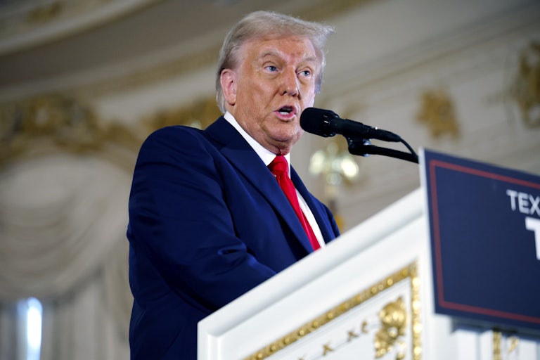 Donald Trump speaks at a podium during a speech at Mar-a-Lago
