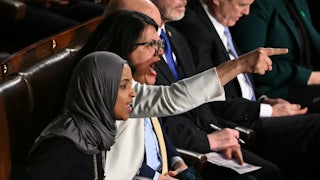 Representatives Rashida Tlaib and Ilhan Omar yell and point fingers during Trump’s State of the Union address.