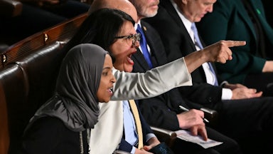 Representatives Rashida Tlaib and Ilhan Omar yell and point fingers during Trump’s State of the Union address.