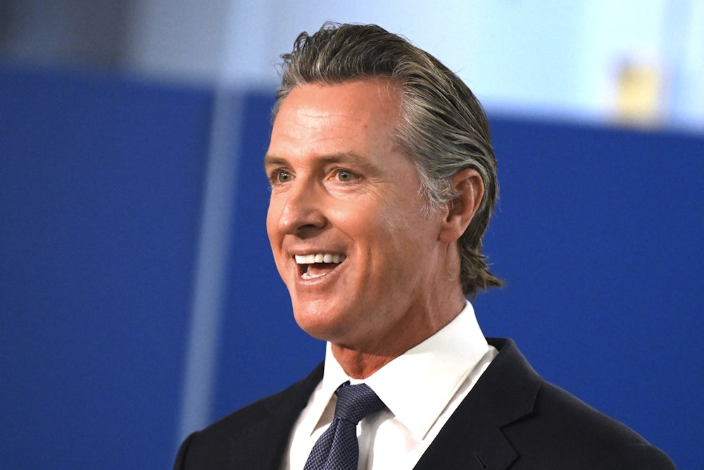 Gavin Newsom smiles with his mouth open