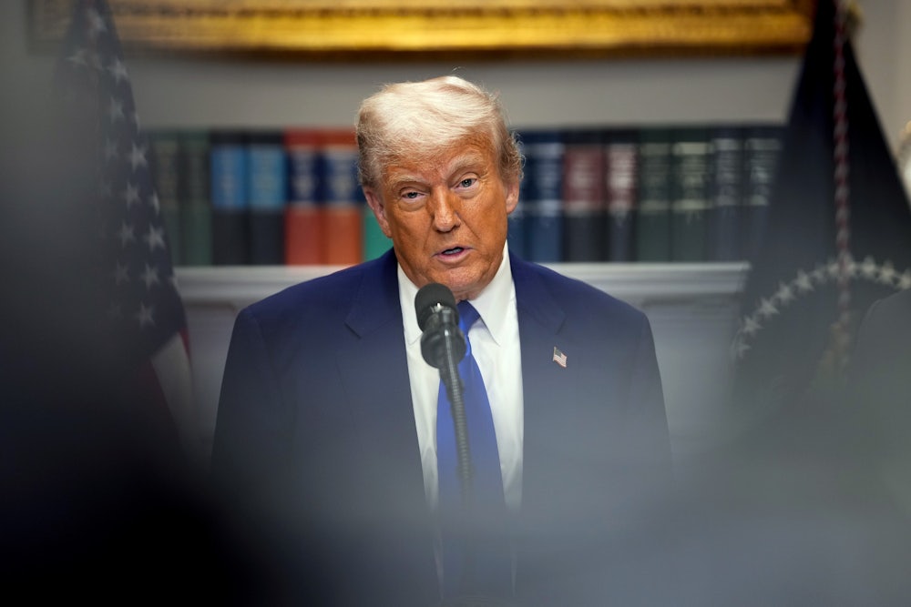 Donald Trump speaks during a press conference in the Roosevelt Room of the White House.