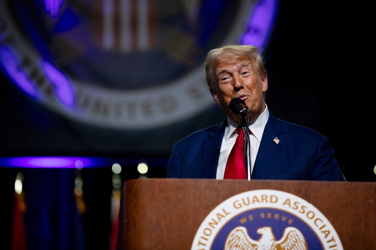 Donald Trump speaks into a microphone at a campaign event
