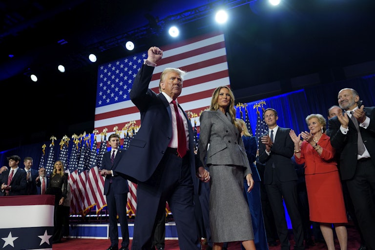 Donald Trump raises his fist during an Election Night party