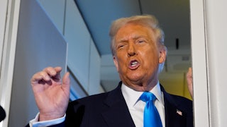 Donald Trump speaks angrily while making a hand gesture aboard Air Force One.