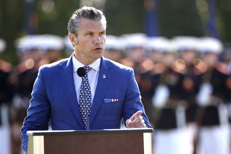 Defense Secretary Pete Hegseth speaks at a podium during an event