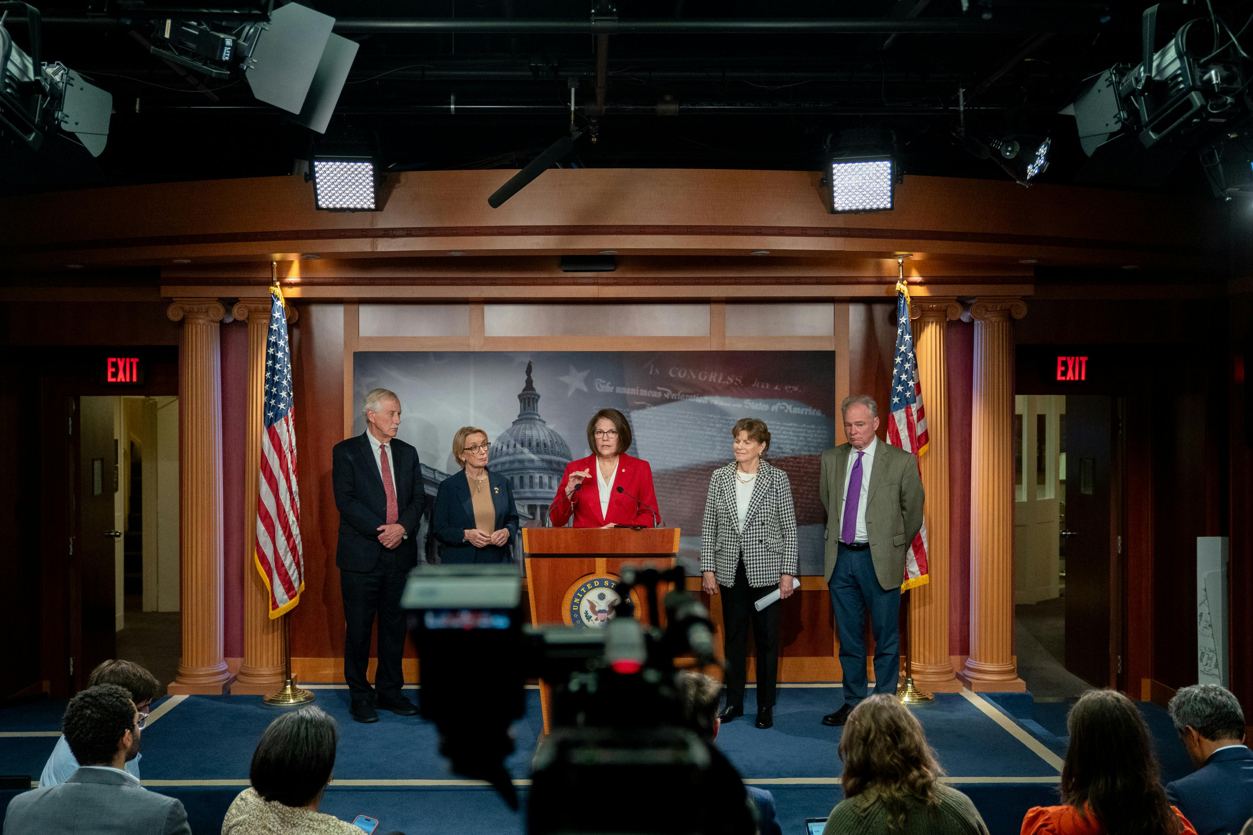 Senators Angus King, Maggie Hassan, Catherine Cortez Masto, Jeanne Shaheen, and Tim Kaine hold a news conference on the Capitol.