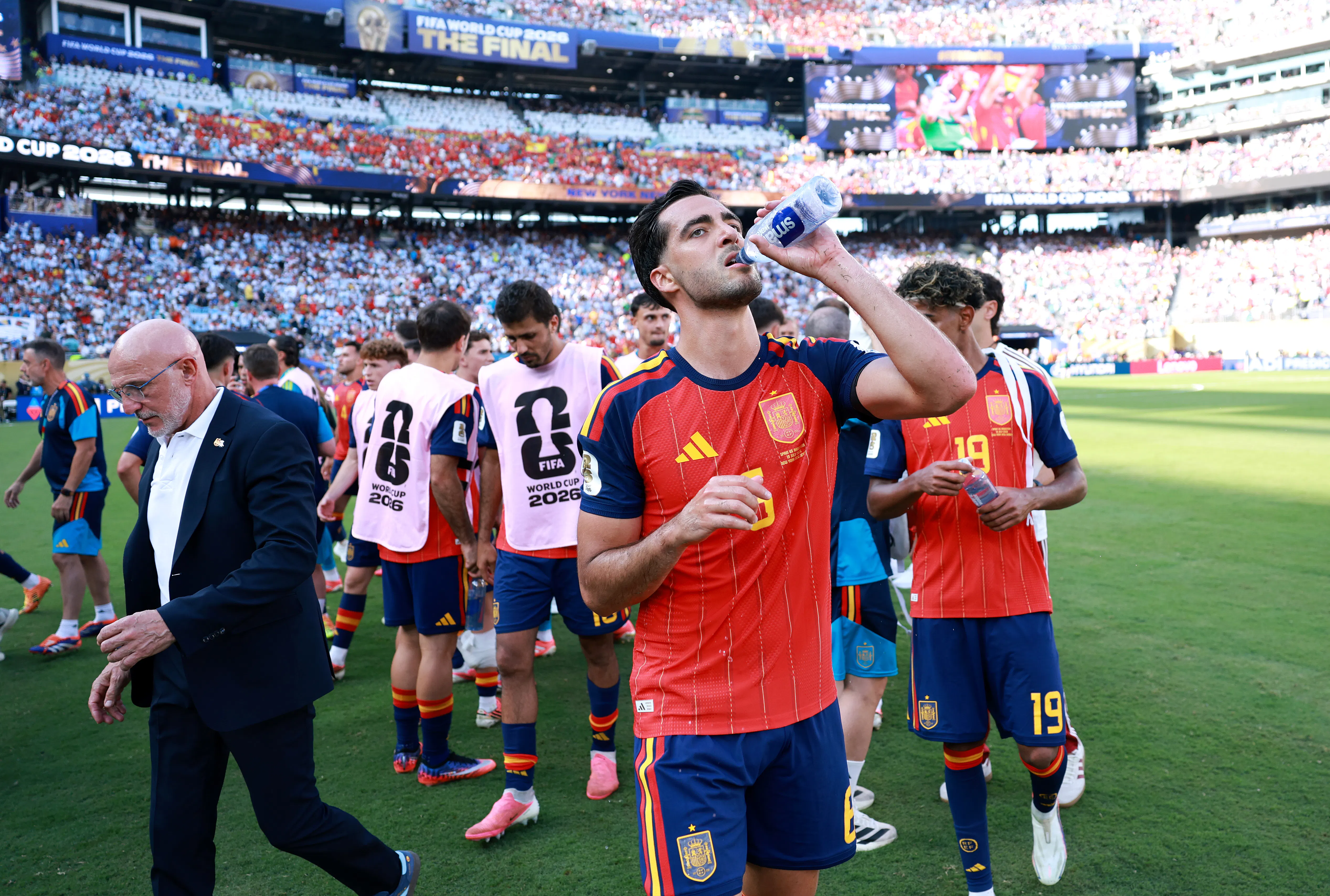 Mikel Merino of Spain takes a drink at a hydration break during the FIFA World Cup 2026 Final match between Spain and Argentina at “New York/New Jersey” Stadium in East Rutherford, New Jersey. 