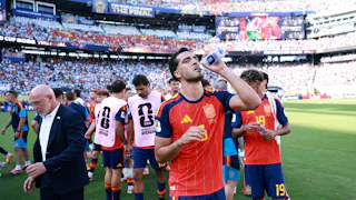 Mikel Merino of Spain takes a drink at a hydration break during the FIFA World Cup 2026 Final match between Spain and Argentina at “New York/New Jersey” Stadium in East Rutherford, New Jersey.