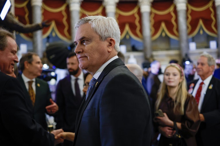 James Comer stands in profile in front of a crowd