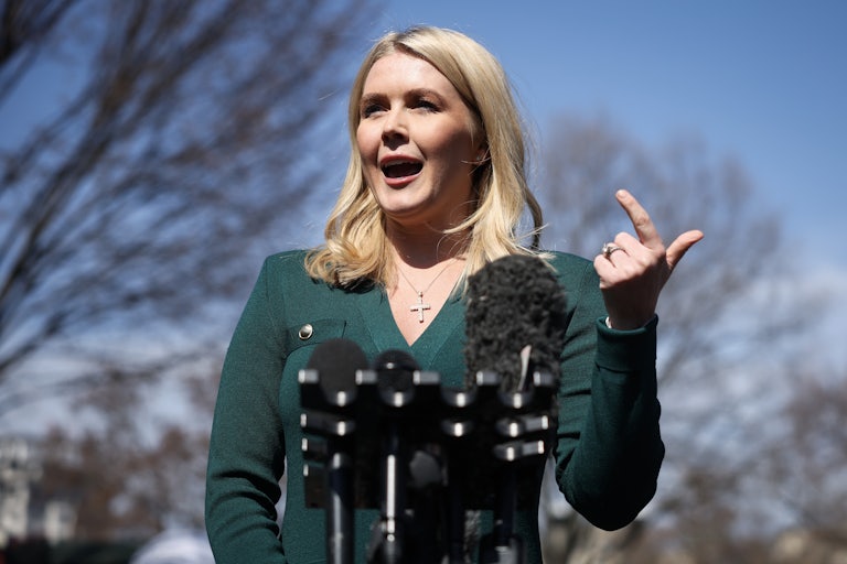 White House Press Secretary Karoline Leavitt gestures while speaking to reporters outside the White House