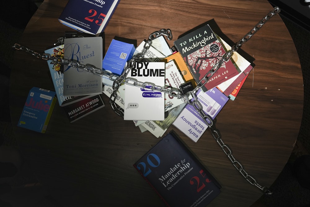 Banned books are chained to a table in "JD Vance's living room" at the Hotties For Harris party during the DNC in Chicago, Illinois on August 21, 2024.