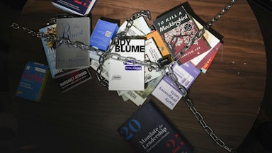 Banned books are chained to a table in "JD Vance's living room" at the Hotties For Harris party during the DNC in Chicago, Illinois on August 21, 2024.