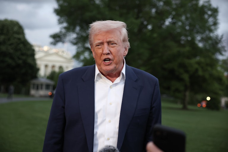 Donald Trump speaks to reporters (not pictured) outside the White House.