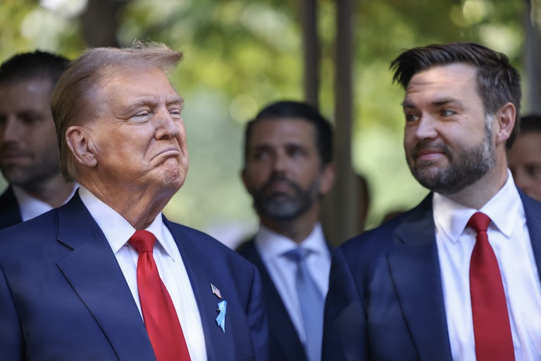 Trump smiles smugly as J.D. Vance looks over at him