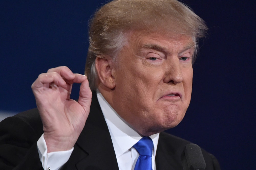 Donald Trump gestures and scowls.