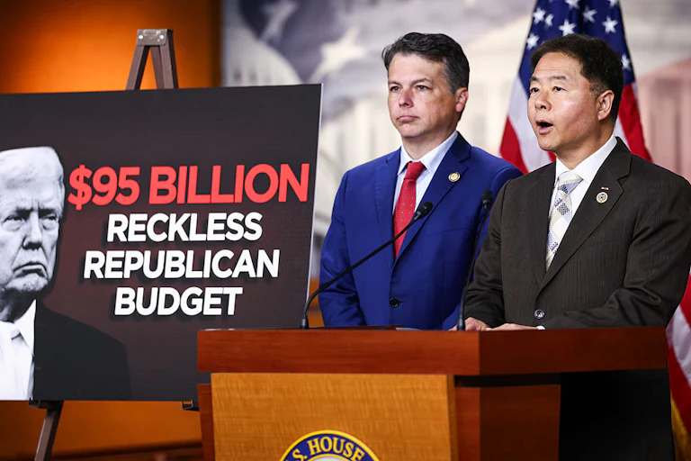 Ted Lieu stands at a lectern, with Brendan Boyle next to him. A poster reads "$95 billion reckless Republican budget."