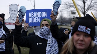 People gather in support of Palestinians outside of the venue where President Joe Biden is speaking to members of the United Auto Workers in Michigan.