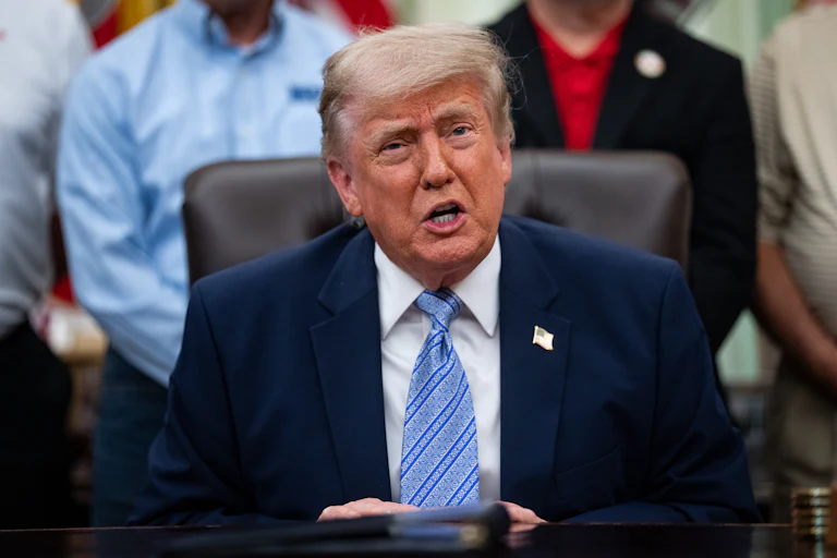 President Trump sitting at his desk.