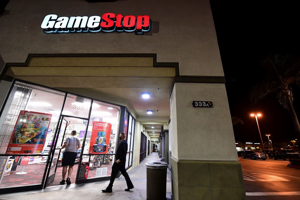 People enter a GameStop store in Alhambra, California.