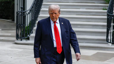 Donald Trump walking outside the White House