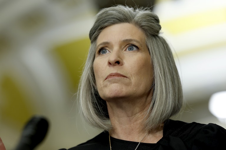 Joni Ernst stares ahead