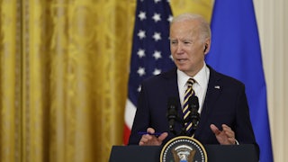 President Joe Biden speaks at a podium