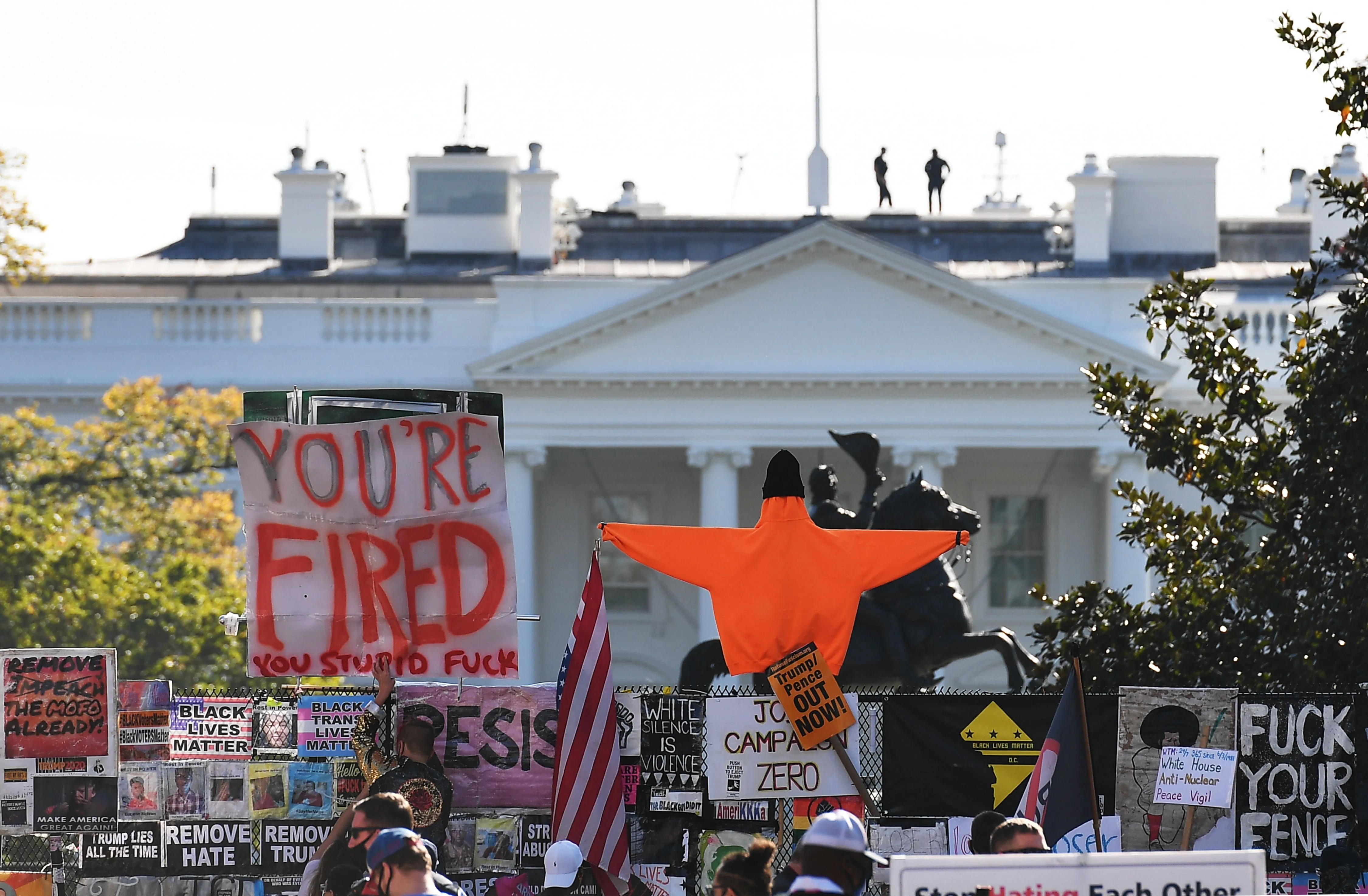 Placards decorate a fence surrounding Lafayette Square in front of the White House in Washington, D.C. on November 6, 2020