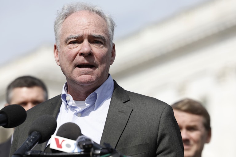 Tim Kaine speaks into a mic