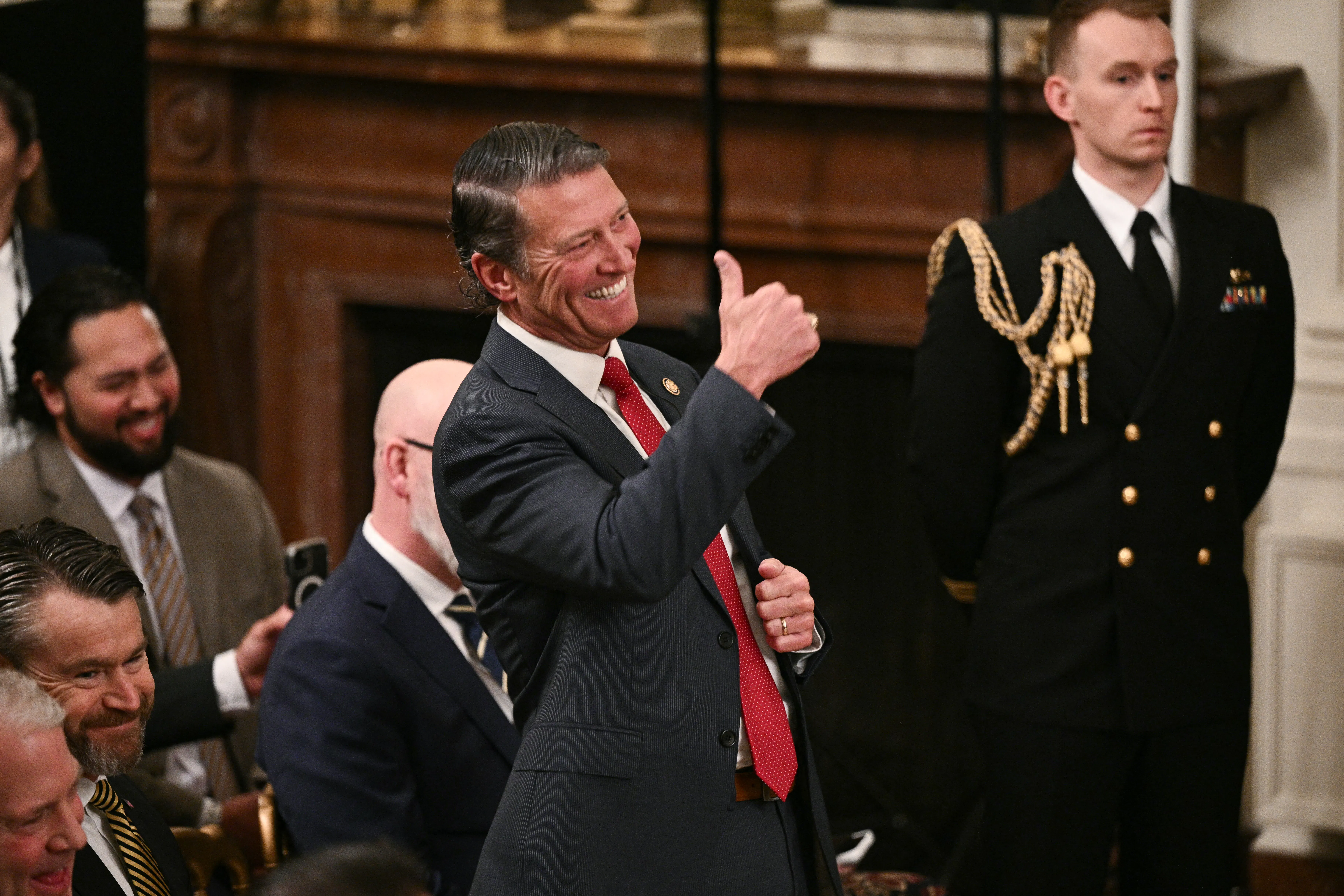 Representative Ronny Jackson gives a thumbs up and smiles