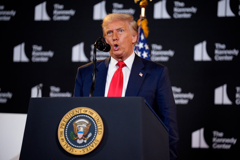 Donald Trump speaks at a podium at the Kennedy Center
