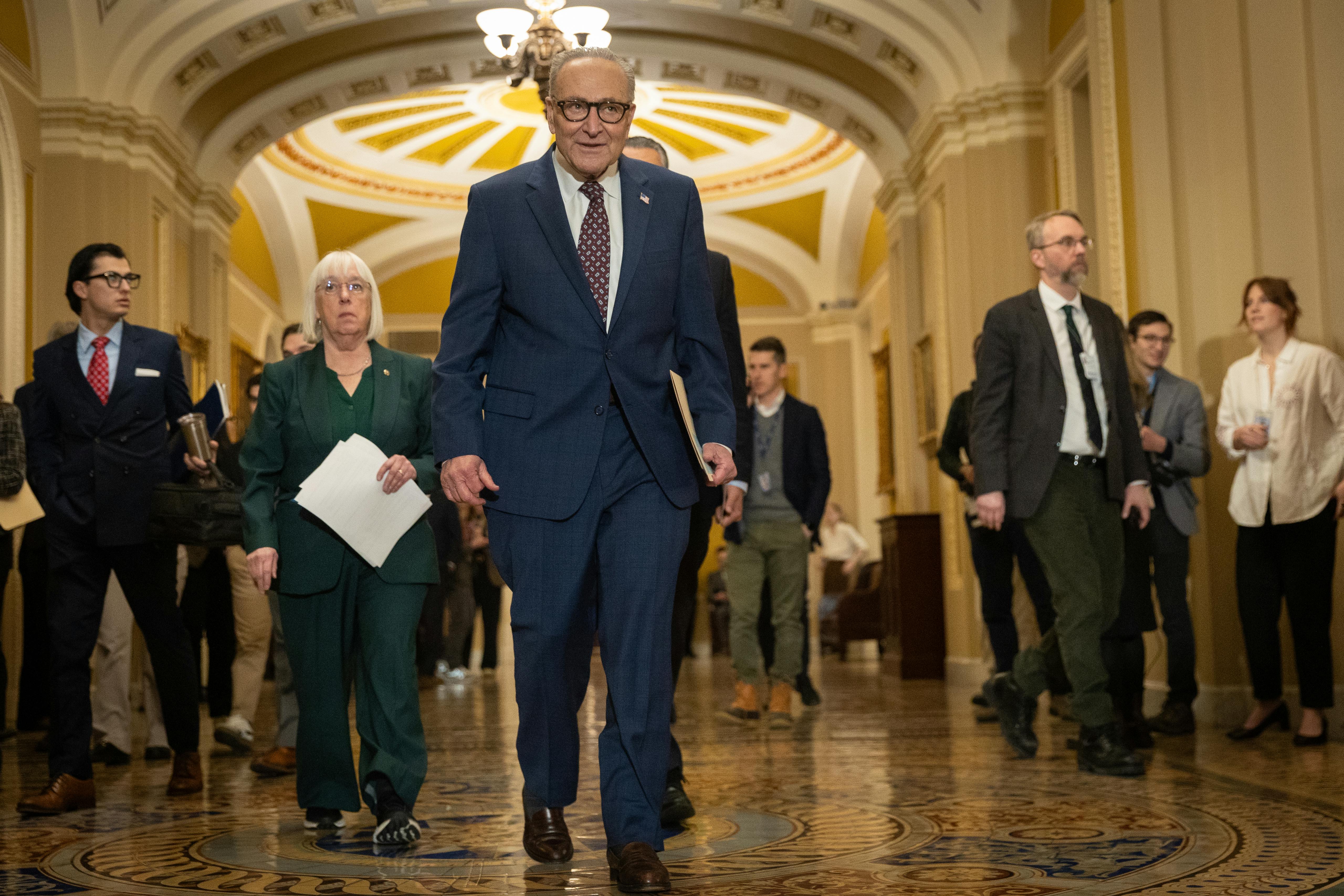Chuck Schumer walking through the Capitol 