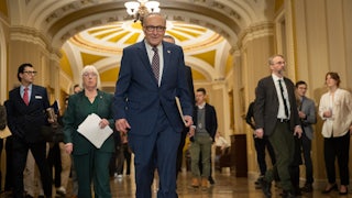 Chuck Schumer walking through the Capitol
