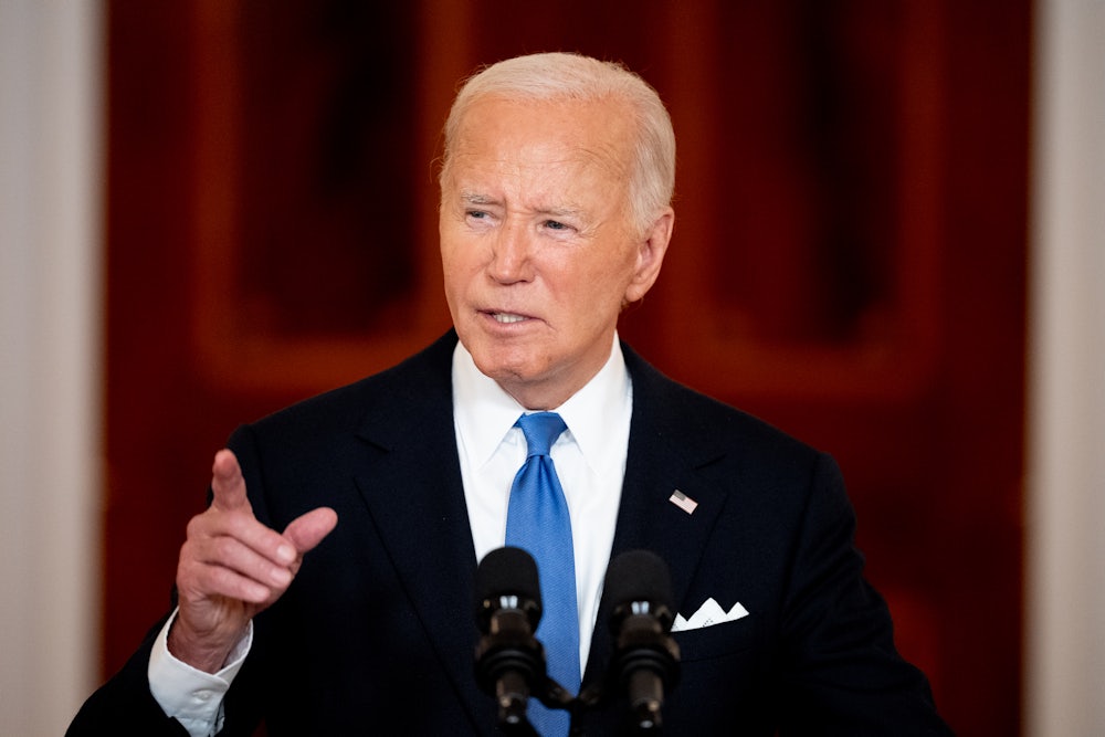 President Biden speaks while pointing a finger in the air