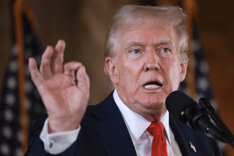Donald Trump gestures while speaking at a press conference at Mar-a-Lago