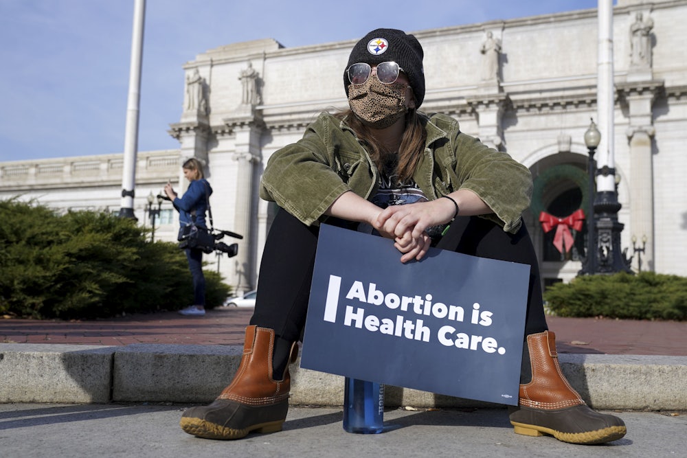 A participant holds a sign during the Women's March "Hold The Line For Abortion Justice" at Union Station on December 01, 2021 in Washington, DC