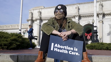 A participant holds a sign during the Women's March "Hold The Line For Abortion Justice" at Union Station on December 01, 2021 in Washington, DC