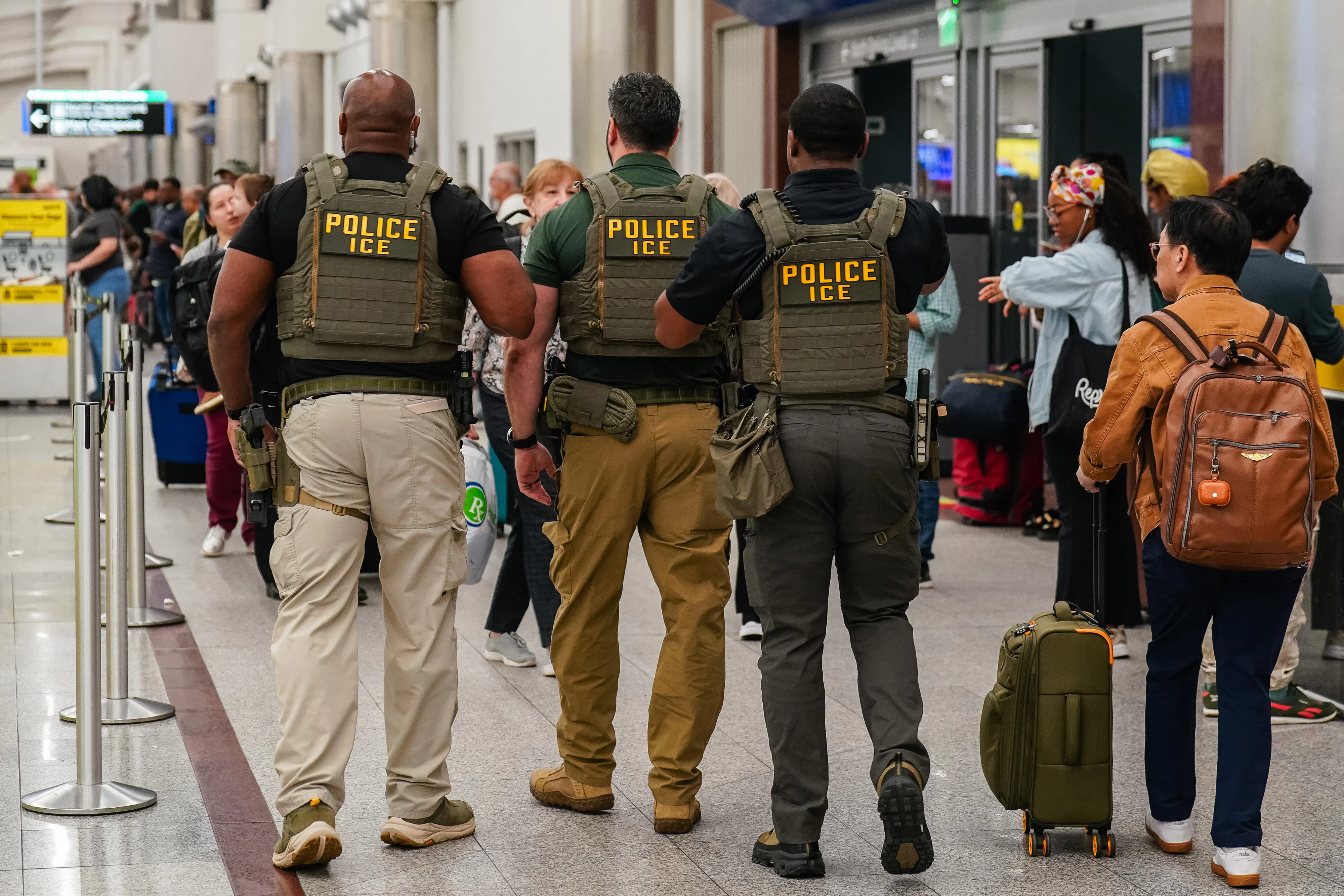 Three ICE agents in ATL airport.